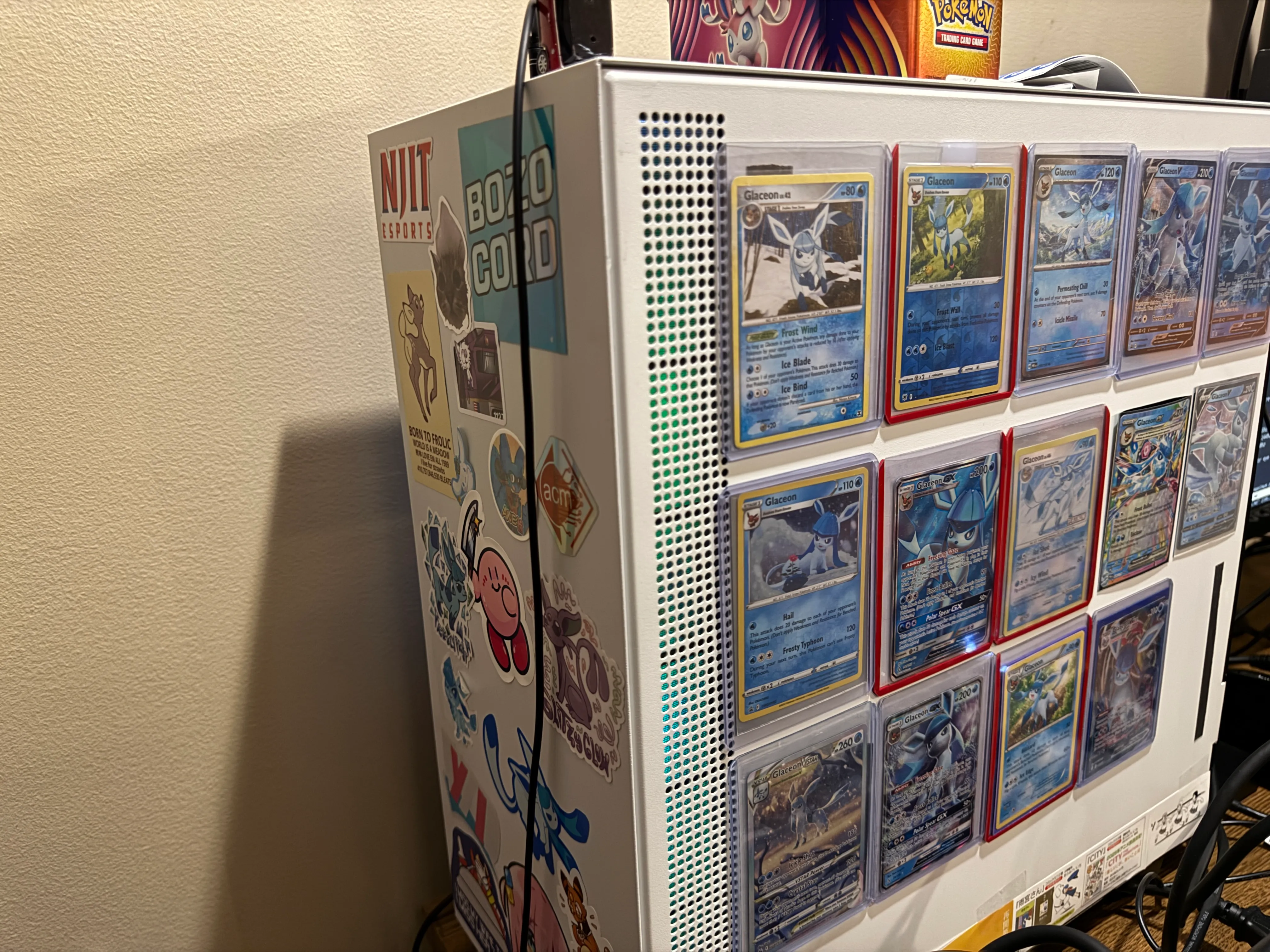 picture of my nzxt h500 tower covered in glaceon cards with magnetic tape to stick them on the front